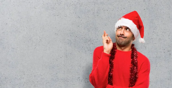 Man Red Clothes Celebrating Christmas Holidays Fingers Crossing Wishing Best — Stock Photo, Image