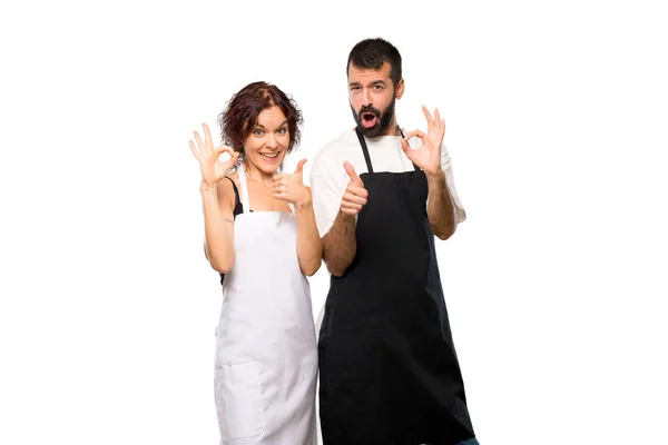 Couple Cooks Showing Sign Giving Thumb Gesture Other Hand Isolated — Stock Photo, Image