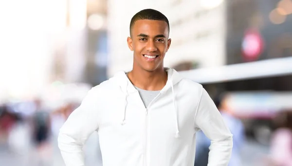 Dark Skinned Young Man White Sweatshirt Posing Arms Hip Laughing — Stock Photo, Image