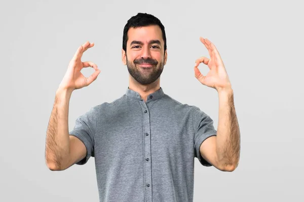 Handsome Man Showing Sign Fingers Grey Background — Stock Photo, Image
