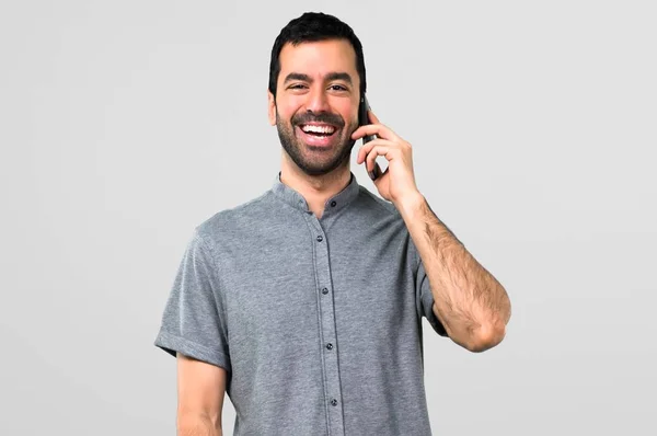 Handsome Man Talking Mobile Grey Background — Stock Photo, Image