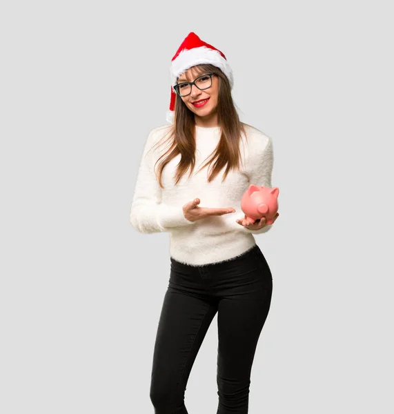 Girl Celebrating Christmas Holidays Holding Big Piggybank Isolated Grey Background — Stock Photo, Image