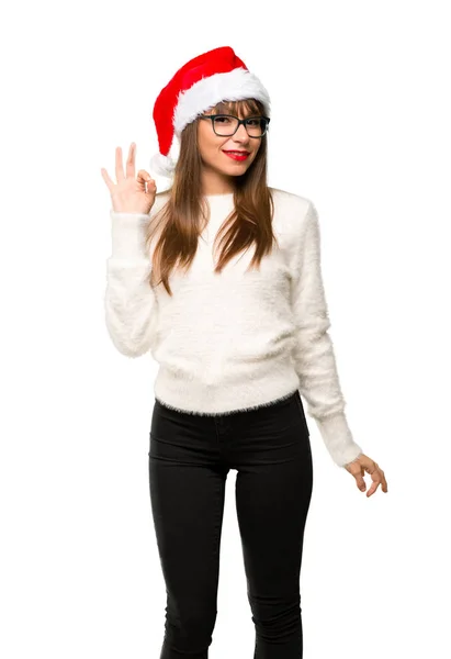 分離の白い背景の上の指で サインを示すクリスマスの休日を祝って 女の子 — ストック写真