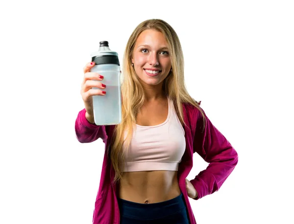 美丽的运动妇女与一瓶水在被隔绝的白色背景 — 图库照片