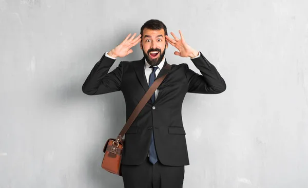 Businessman with beard with surprise and shocked facial expression