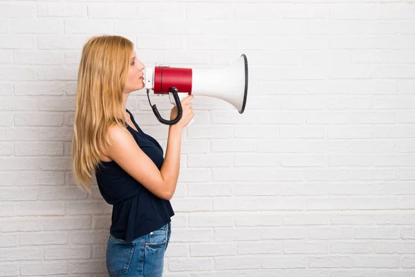 Blonde Girl Holding Megaphone White Brick Wall Background — Stock Photo, Image