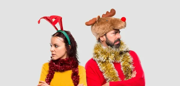 Couple Dressed Christmas Holidays Having Doubts Confuse Face Expression While — Stock Photo, Image