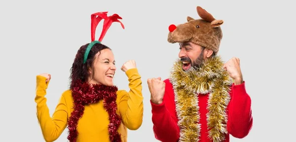 Couple Dressed Christmas Holidays Celebrating Victory Winner Position Isolated Background — Stock Photo, Image