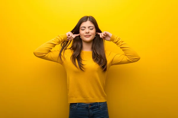 Teenager Girl Vibrant Yellow Background Covering Both Ears Hands — Stock Photo, Image