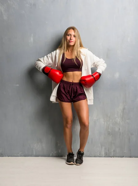 Young sport woman with boxing gloves