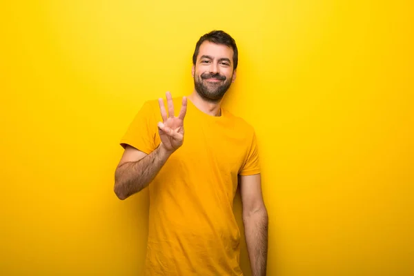 Muž Izolované Zářivé Žluté Barvy Šťastný Počítání Tři Prsty — Stock fotografie