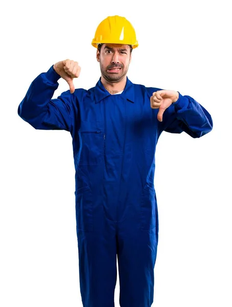 Young Workman Helmet Showing Thumb Both Hands Negative Expression Isolated — Stock Photo, Image