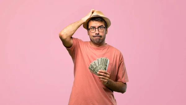 Man Holding Many Bills Expression Frustration Understanding Pink Background — Stock Photo, Image