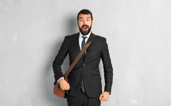 Businessman with beard with surprise and shocked facial expression