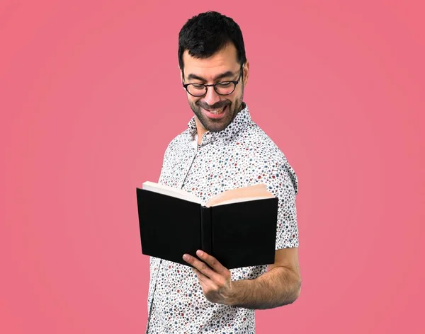 Handsome Man Glasses Reading Book Pink Background — Stock Photo, Image