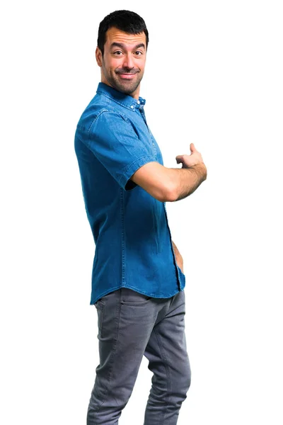 Przystojny Mężczyzna Niebieską Koszulę Wskazując Powraca Palcem Wskazującym — Zdjęcie stockowe