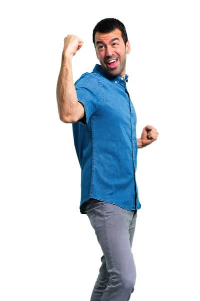 Knappe Man Met Blauwe Shirt Een Overwinning Vieren — Stockfoto