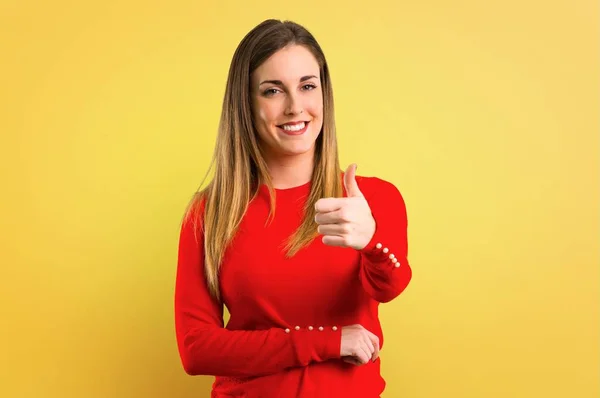 Young Blonde Woman Giving Thumbs Gesture Smiling Yellow Background — Stock Photo, Image