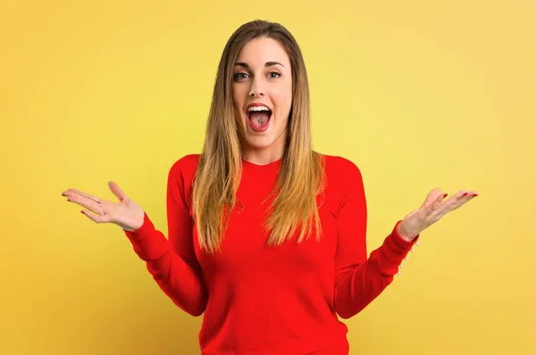 Young Blonde Woman Surprise Shocked Facial Expression Yellow Background — Stock Photo, Image