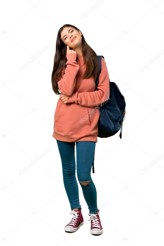 A full-length shot of a Teenager girl with sweatshirt and backpack smiling with a sweet expression