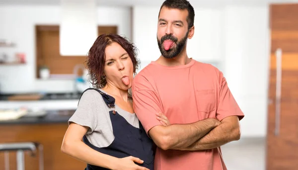 Couple Pregnant Woman Showing Tongue Camera Having Funny Look House — Stock Photo, Image