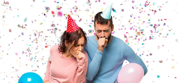 Pareja Con Globos Sombreros Cumpleaños Está Sufriendo Tos Sentirse Mal —  Fotos de Stock