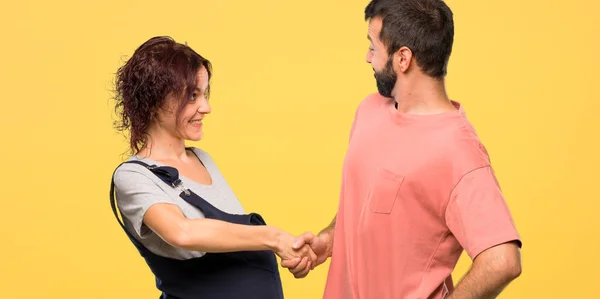 Couple Pregnant Woman Shaking Hands Closing Good Deal Isolated Yellow — Stock Photo, Image