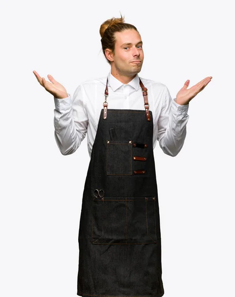 Barber Man Apron Having Doubts While Raising Hands Shoulders Isolated — Stock Photo, Image