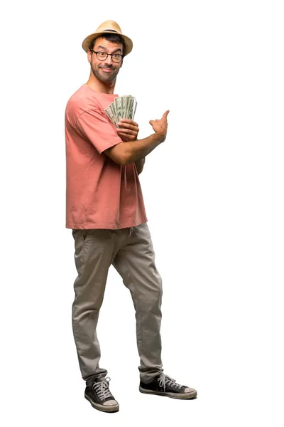 Man Holding Many Bills Pointing Back Index Finger Isolated White — Stock Photo, Image