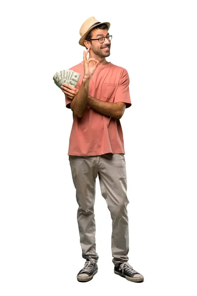 Man Holding Many Bills Showing Sign While Winking Eye Isolated — Stock Photo, Image