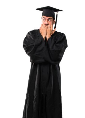 Biraz gergin ve korkmuş koyarak eller izole beyaz zemin üzerine ağzına onun mezuniyet günü üniversite demektir