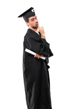 Ağız ve sessizlik kapanış bir işaret gösteren onun mezuniyet günü üniversite adam ağzına koyarak parmak jest