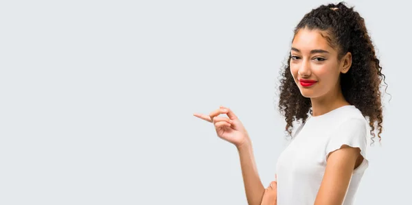 Young Girl Curly Hair Pointing Finger Side Presenting Product Lateral — Stock fotografie