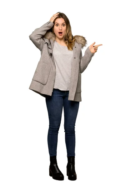 Full Length Shot Teenager Girl Coat Pointing Finger Side Presenting — Stok fotoğraf