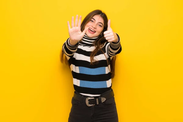 Young Woman Yellow Wall Counting Six Fingers — Stock Photo, Image