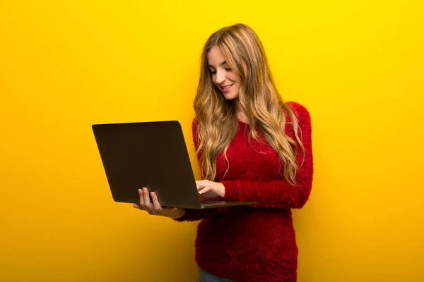 Young Girl Vibrant Yellow Background Laptop — Stock Photo, Image