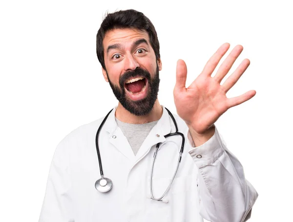 Young Doctor Saluting White Background — Stock Photo, Image
