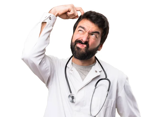 Junger Arzt Mit Zweifeln Weißem Hintergrund — Stockfoto