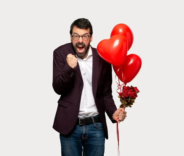 Man in valentine day frustrated by a bad situation over isolated grey background