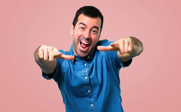 Handsome Man Blue Shirt Pointing Finger Someone Laughing Lot Pink — Stock Photo, Image