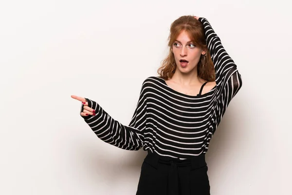 Young Redhead Woman White Wall Pointing Finger Side Presenting Product — Stock Photo, Image