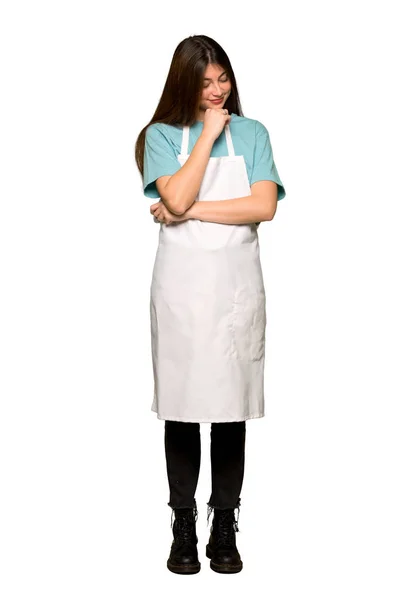Full Length Shot Girl Apron Looking Hand Chin Isolated White — Stock Photo, Image