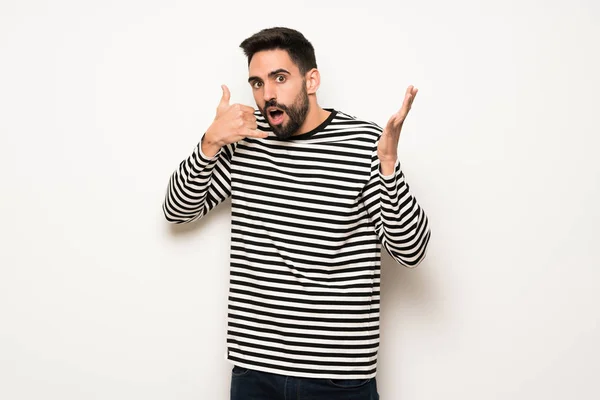 Hombre Guapo Con Camisa Rayas Haciendo Gesto Teléfono Dudando — Foto de Stock