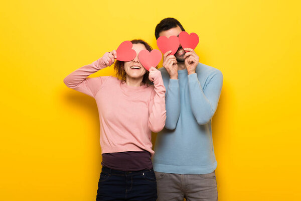 Couple in valentine day holding a heart symbol