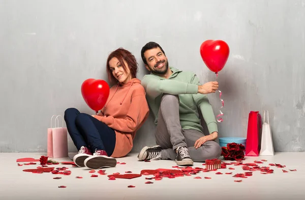 Couple in valentine day with balloons with heart shape