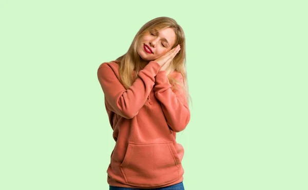 Young Girl Making Sleep Gesture Dorable Expression Green Background — Stock Photo, Image