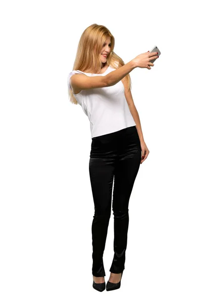 Young Blonde Woman Troubled Holding Broken Smartphone Isolated White Background — Stock Photo, Image