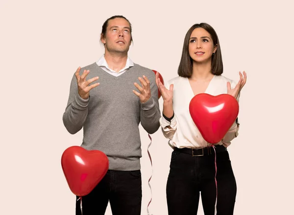 Couple in valentine day frustrated by a bad situation over isolated background