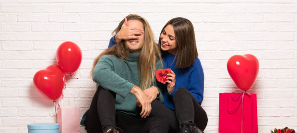 Couple in valentine day holding gift box