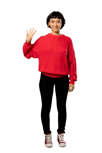 分離の白い背景の上の指を使って赤いセーター幸せとカウント と短い髪の女の子のフルレングス ショット — ストック写真
